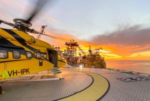 PHI yellow & black helicopter on offshore platform