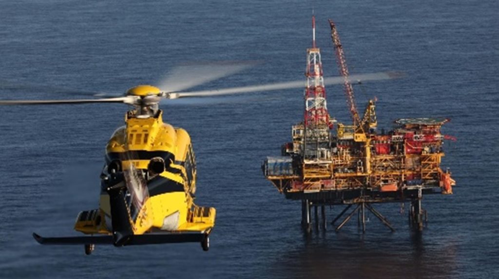 PHI helicopter flying offshore to the rigs in the Taranaki Basin