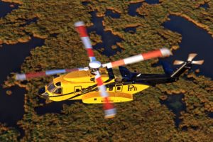 A PHI Sikorsky S-92 Cruises Over The Louisiana Swamps