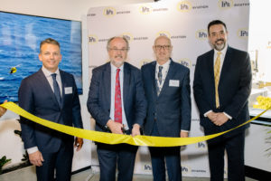 PHI and Western Australia energy leaders pose for ribbon cutting photo